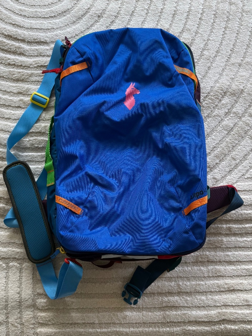 Cotopaxi 42L backpack with removable waist belt and rain shell